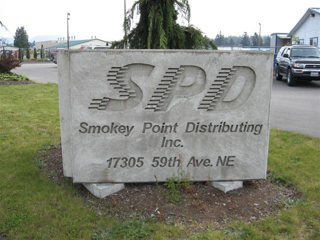 Concrete sign for Smokey Point Distributing Inc.