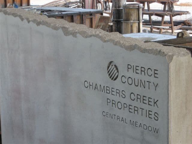 Concrete wall signage for Pierce County Chambers Creek Properties
